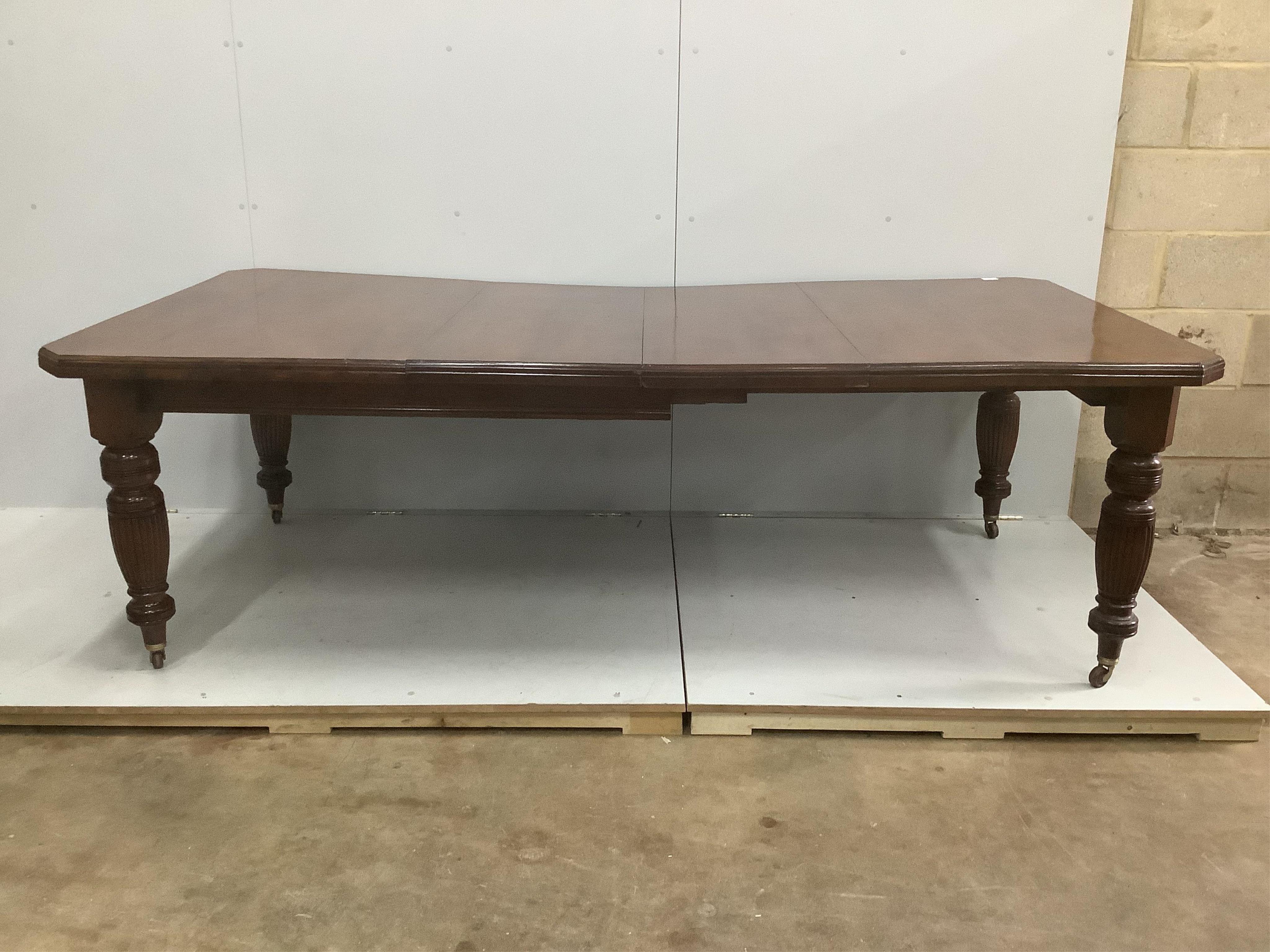 A late Victorian walnut extending dining table, width 232cm extended, two spare leaves, depth 118cm, height 73cm. Condition - good